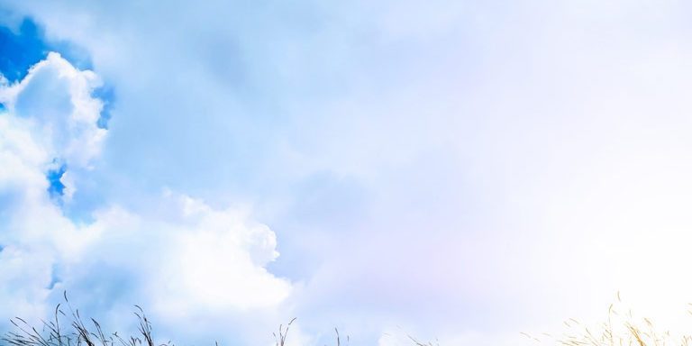 Silhouette Of Sad A Woman Depressed Sitting Alone On Meadow.